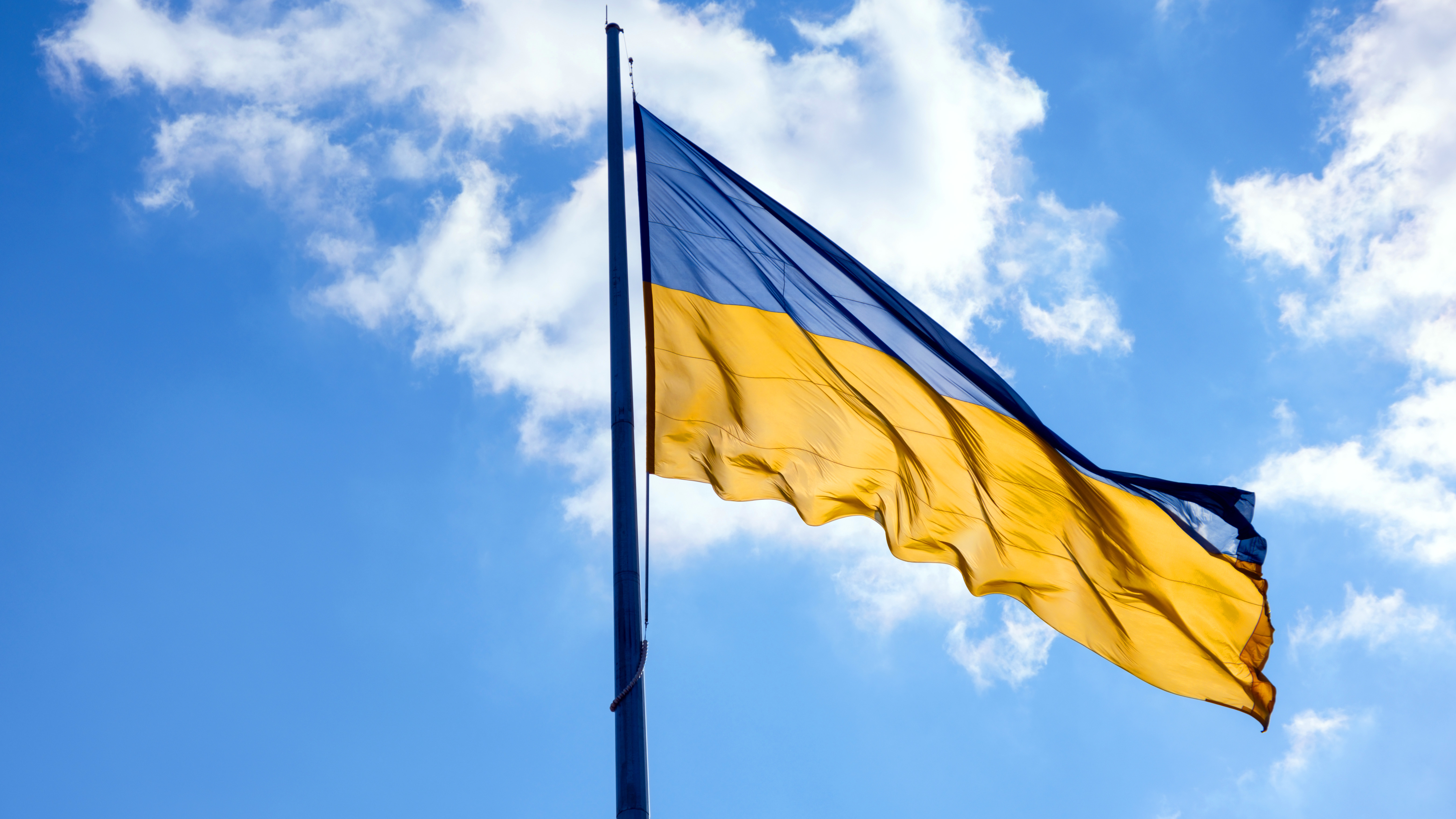 Flag of ukraine flutters in blue sky large yellow 2022 03 29 23 37 35 utc